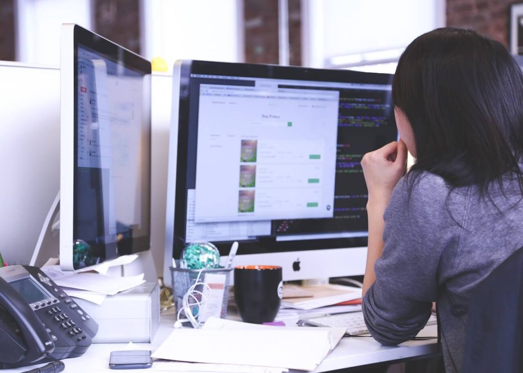 Close-up of Businesswoman Desk with Laptop