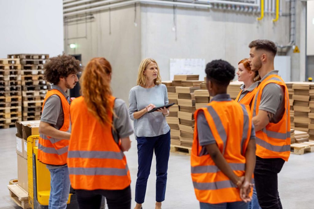 Workers in a warehouse on a meeting
